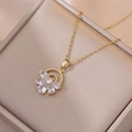 Elegant gold flower necklace with rhinestone petals on a soft beige velvet jewelry box - Gold Zirconia Flower Necklace (X2199)