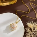 Vintage gouden ketting met ovale marmeren hanger en parelster in een luxe setting - Ster Medaillon (Goud Wit)