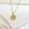 Golden oval locket necklace with starburst engraving and small central gemstone - Oval Star Style (Gold)