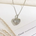 Silver heart locket necklace with a shimmering zircon star pattern on a delicate chain - Heart Star Style (Silver)