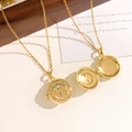 Vintage gold locket necklace with floral relief and gemstones, shown open and closed - Wings Locket