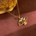Elegant gold fan pendant necklace with white enamel bamboo leaves on dark texture - White Fan Style (XL4974) / Gold
