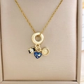 Gold travel charm necklace featuring camera, blue heart map and compass pendants - Gold