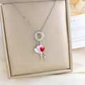Zilveren ketting met witte, roze en rode hartballonnen en een Happy-label - Hart Ketting Zilver (XL4420)