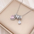 Silver necklace with pink heart and teardrop gems on a brushed gold display box - Heart Water Drop Combination (XL4319) / Silver
