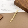 Exquisite gold-plated necklace with sparkling floral, leaf, and butterfly cubic zirconia pendants - XL5112 Flower Star Tassel Necklace / Gold