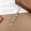 Silver star moon butterfly heart charm necklace with cubic zirconia in a romantic setting - XL5128 Snowflake Butterfly Tassel Necklace / Silver