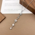 Silver celestial pendant necklace featuring sun, palm tree, and cubic zirconia stars - XL5134 Sun Star Tassel Necklace / Silver