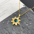 Collier tournesol doré avec pierre précieuse bleu foncé et chaîne à maillons fine - Fleur à Huit Pétales Planète (XL1455) / Or