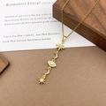 Gold plated celestial necklace with zircon star moon and evil eye charms on wood - XL5136 Star Eye Tassel Necklace / Gold