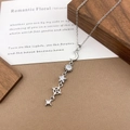 Silver celestial drop necklace featuring moon sun and star charms with sparkling zircons - XL5141 Moon Star Tassel Necklace / Silver