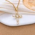 Elegant gold cross necklace with oval zircons on a delicate chain in warm lighting - Mixed Cut Zirconia Cross Style (XL3429) / Gold