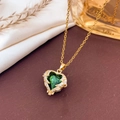 Luxurious gold necklace with a heart-shaped emerald green pendant and diamond halo - Necklace / Emerald Green - Gold