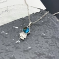 Silver astronaut necklace with blue starry galaxy pendant on modern textured glass - Astronaut Planet (XL1117) / Silver