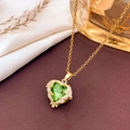 Luxury heart-shaped green crystal necklace with gold feather frame and dainty chain - Necklace / Apple Green - Gold