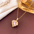 Pink heart crystal necklace with golden wing accents and fine chain for women - Necklace / Pink-Gold