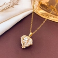 Golden heart-shaped crystal pendant necklace with sparkling diamonds on silk fabric - Necklace / White-Gold