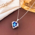 Silver necklace with a large heart-shaped blue sapphire pendant and sparkling pavé diamonds - Necklace / Blue-Silver