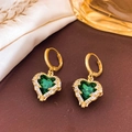Elegant gold-plated heart earrings with green gemstones and zircon halos on a silk background - Earrings / Emerald Green - Gold