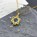 Gold star necklace with deep blue cosmic pendant and crystal halo on glass - Flower Planet (XL3532) / Gold