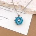 Titanium steel necklace featuring a rotating blue daisy flower pendant with white zircon - Blue Rotating Daisy (XL1832) / Silver