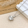 Silver heart-shaped crystal necklace with a tiny floral accent and sparkling crystals - Necklace / Silver / Clear White