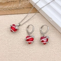 Elegant jewelry set with red heart-shaped gemstone necklace and matching hoop earrings - Necklace and Earring Set / Silver / Red