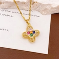 Elegante goldene Halskette mit einem drehbaren Planeten-Herz-Anhänger und bunten Steinen - XL2594 Rotierender Vierblättriger Blumenanhänger Gold