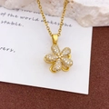 Elegante drehende Sonnenblumen-Halskette in Gold-Finish mit funkelnden Zirkonia-Steinen - Rotierende Fünfblättrige Blume Halskette Gold (XL2359)
