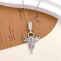 Silver phoenix pendant necklace with pavé zircons on a rustic gift card display - Phoenix Wing Design (XL2068) / Gold