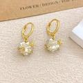 Elegant gold heart earrings with clear faceted crystals and delicate gold floral accents - Ear Buckle / Gold / Clear White