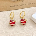 Golden hoop earrings with red heart-shaped gemstone and spiral diamond-set accents - Ear Buckle / Gold / Red