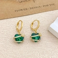 Elegant gold earrings with emerald green heart gems and white zircon ribbon accents - Ear Buckle / Gold / Green