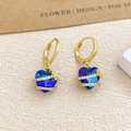 Elegant gold heart earrings with deep blue gemstones and sparkling floral accents - Ear Buckle / Gold / Light Blue