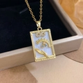 Gold Magician tarot necklace featuring a sun and star pendant with blue gemstone - Gold - The Magician (XL2299)