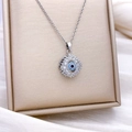 Silver rotating Evil Eye necklace with blue crystals and sunflower shape pendant - Rotatable Evil Eye Style (XL860) / Silver