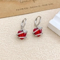 Elegant pair of silver heart earrings with vibrant red crystals and floral details - Ear Buckle / Silver / Red