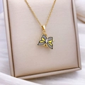 Golden butterfly necklace with yellow and grey enamel wings on a champagne display - Rotatable Butterfly Style (XL2304) / Gold