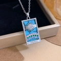Silver Tarot Sun necklace with blue turquoise base and colorful gemstones on black background - Silver Blue - Rainbow Sun (XL2702)