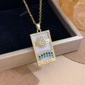 Golden tarot 'The Sun' necklace with colorful crystals on a black velvet lining - Gold White - Rainbow Sun (XL2702)