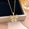 Elegante gouden ketting met strik-hanger bezet met zirkonia en parel-accenten - Goud (XL3487)