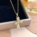 Elegante gouden ketting met strikje en schitterende zirkonia op een juwelendoosje - Goud (XL3738)