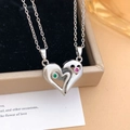 Magnetic heart couple necklaces set with green and red gems in a silver finish - Heart to Heart Style (XL2509) / Silver