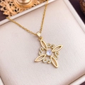Golden Celtic knot necklace with central sparkling diamond on beige satin jewelry box - Gold Square Circle Geometric Style (XL1824)
