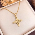 Elegant gold-plated Celtic Witch Knot necklace displayed in a premium velvet jewelry box - Gold Smooth Oval Style (XL2057)