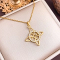 Golden Celtic witch knot necklace with sparkling zircon circle on a white jewelry box - Gold Circle Hollow Style (XL3362)