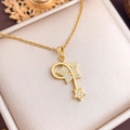 Gold star moon necklace with white zircon pavé setting on a cream jewelry box - Shooting Star (XL2085) / Gold