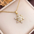 Golden snowflake pendant necklace with cubic zirconia on a luxury champagne jewelry box - Six-Petal Flower Snowflake (XL2885) / Gold