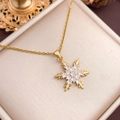 Elegant gold snowflake pendant necklace with cubic zirconia on a beige jewelry box display - Classic Snowflake (XL3398) / Gold