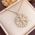 Golden snowflake pendant necklace with white zircons on a champagne silk background - Large Snowflake (XL4615) / Gold
